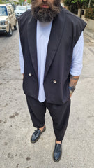 Clint wore trousers and a sleeveless jacket.