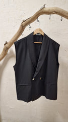 Clint wore trousers and a sleeveless jacket.